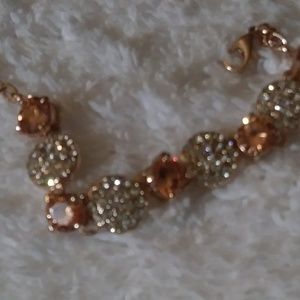 Gold tone bracelet with rhinestones